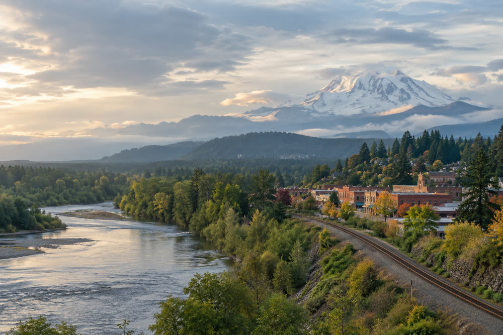 The river valley at Auburn with a rail line and Mount Rainier rising behind